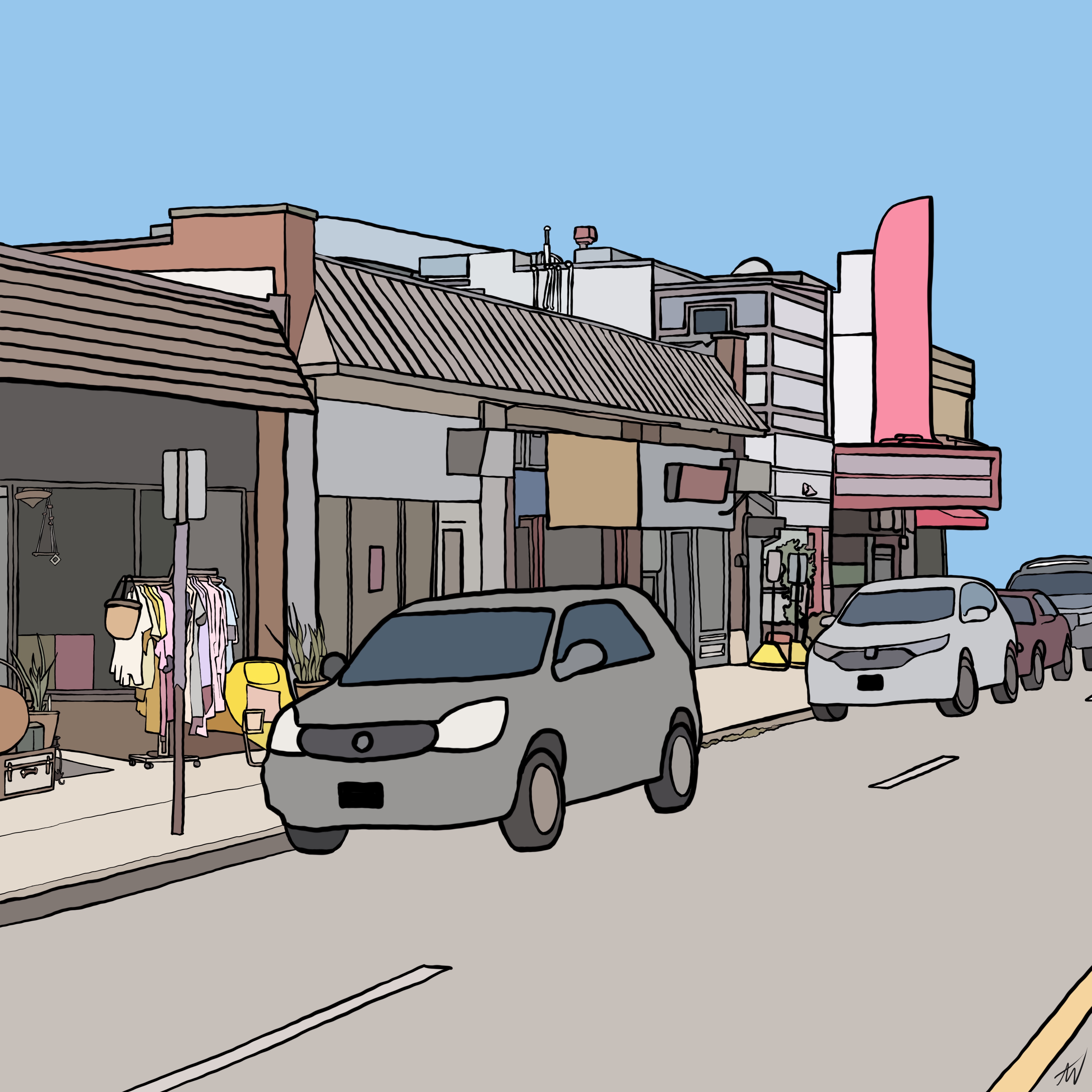 the streetside view of shops and a theater